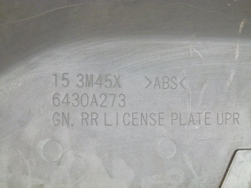 MITSUBISHI PAJERO REAR BUMPER LICENSE PLATE HOUSING TRIM GENUINE 6430A273